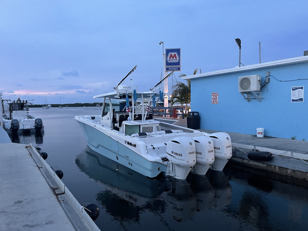 A docked boat equipped with tools and technology, serving as a base for the underwater classroom activities and exploration missions.